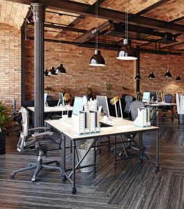 Image of an Office Building with brick walls and worktables for Rosewood Inc.'s Web Design Team