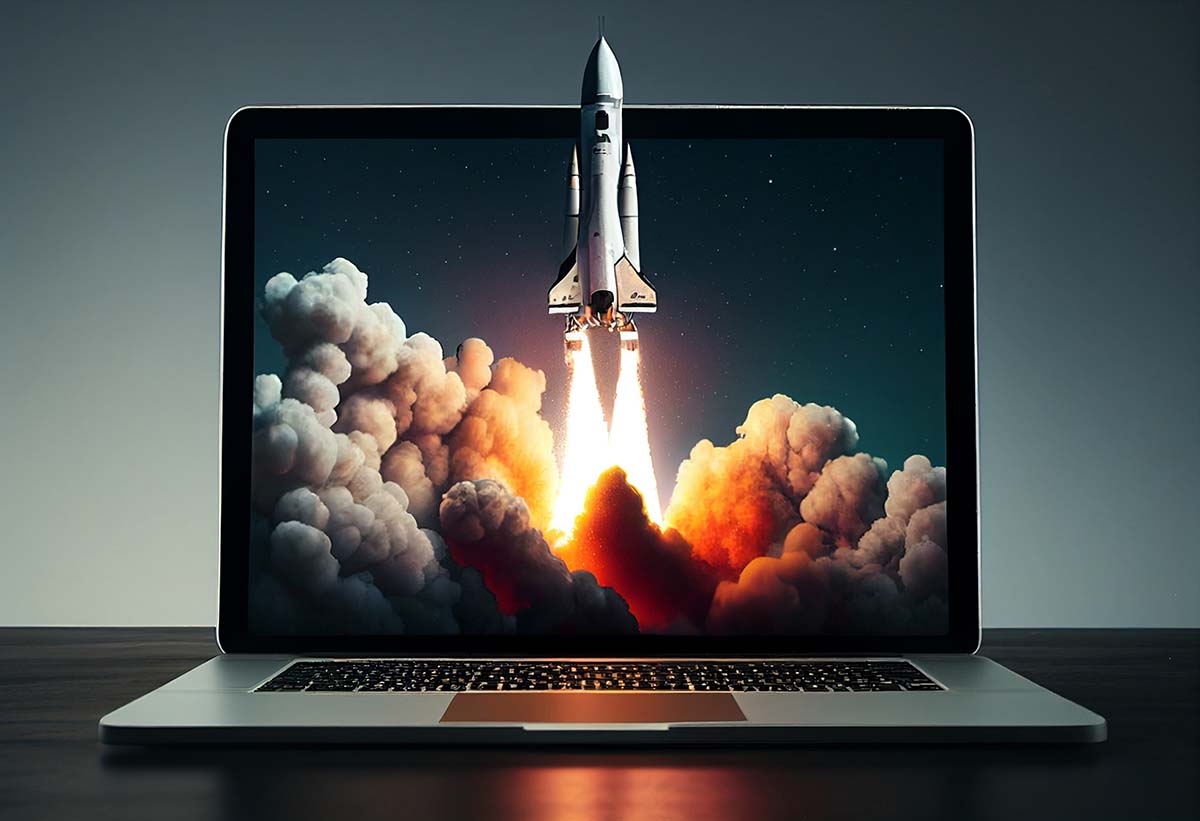 A rocket launching out of a laptop. A metaphor for speeding up website loading times.