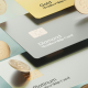 Floating credit cards of three different tiers with coins of money falling around