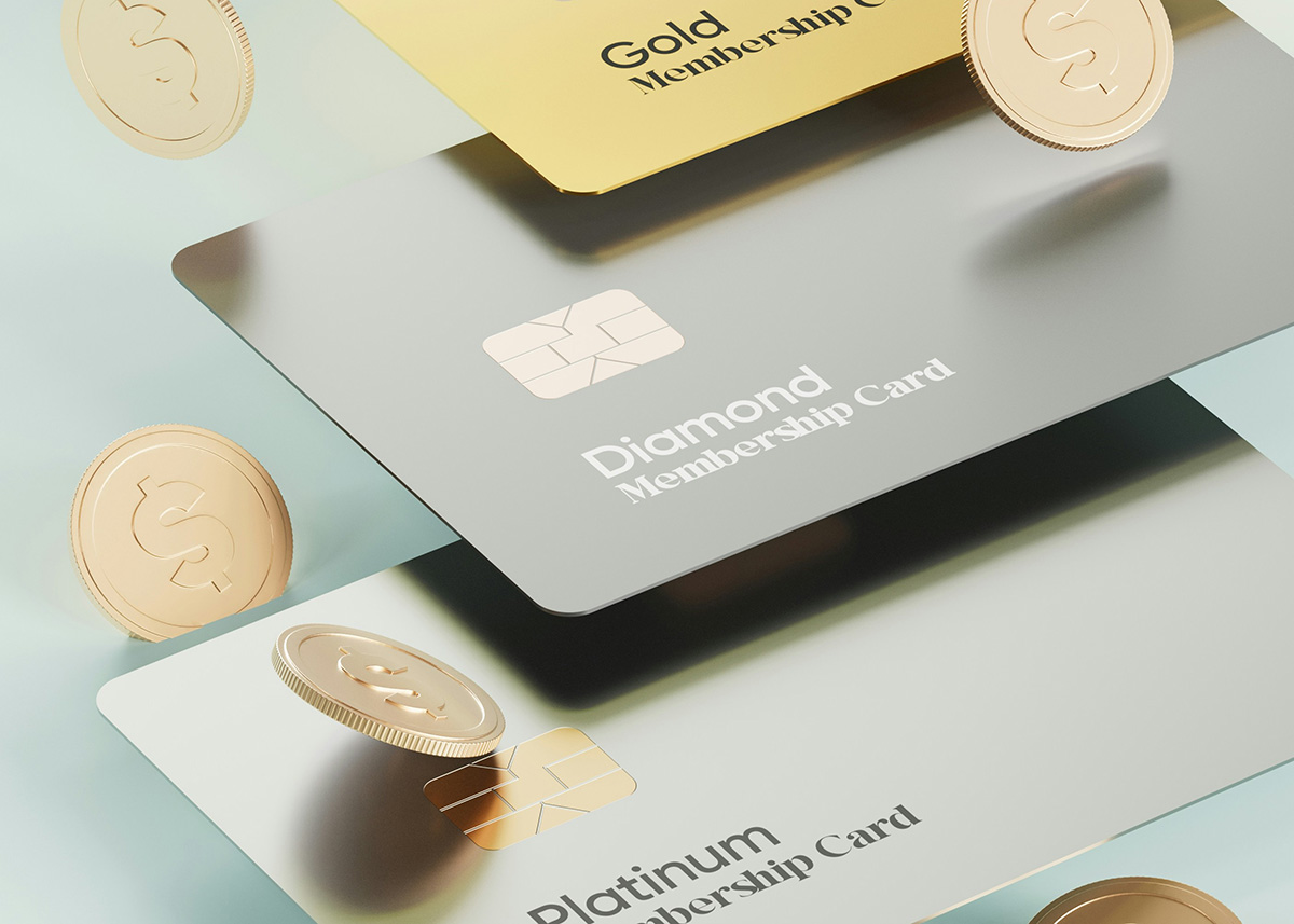 Floating credit cards of three different tiers with coins of money falling around