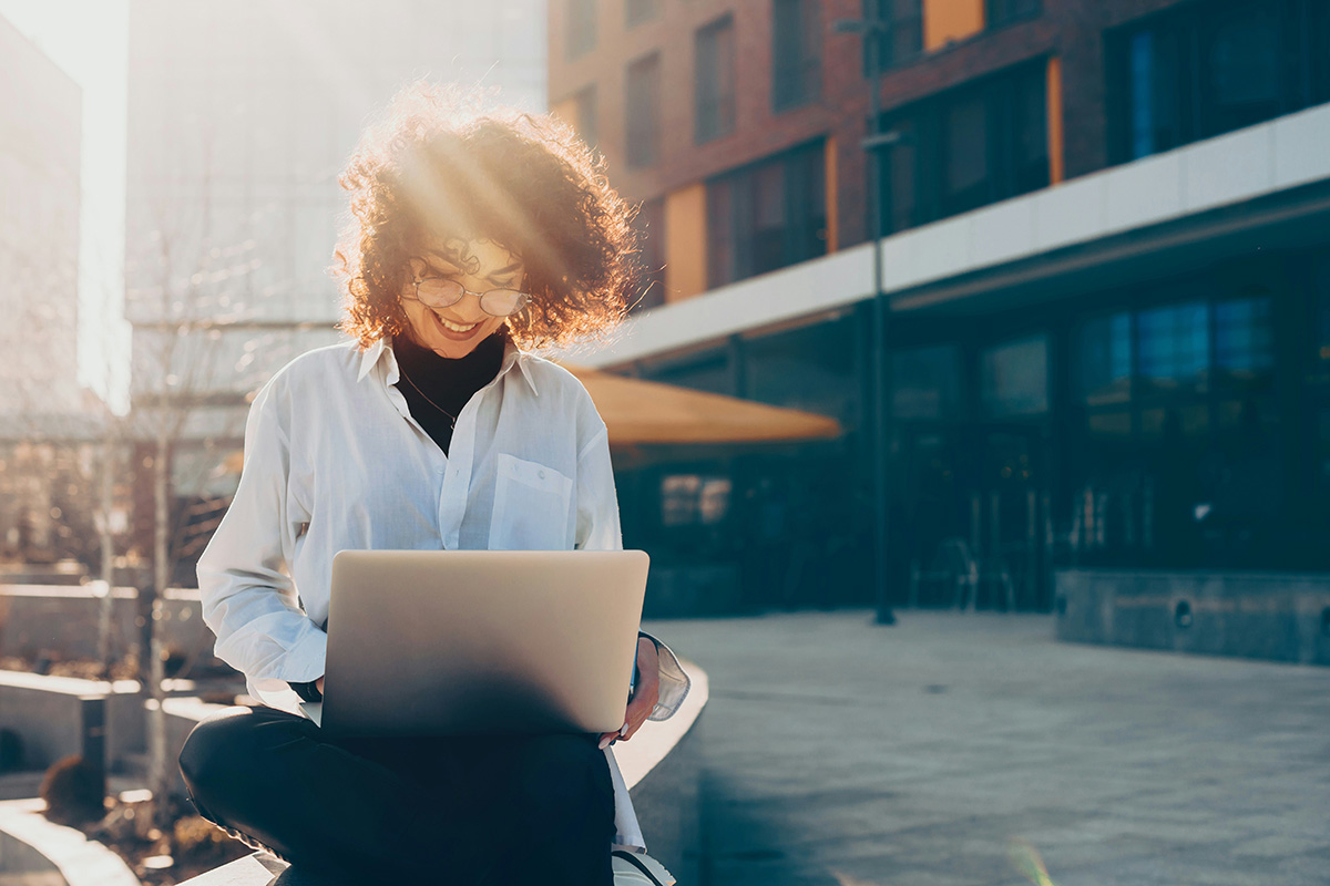 A woman working on her laptop doing lead generation